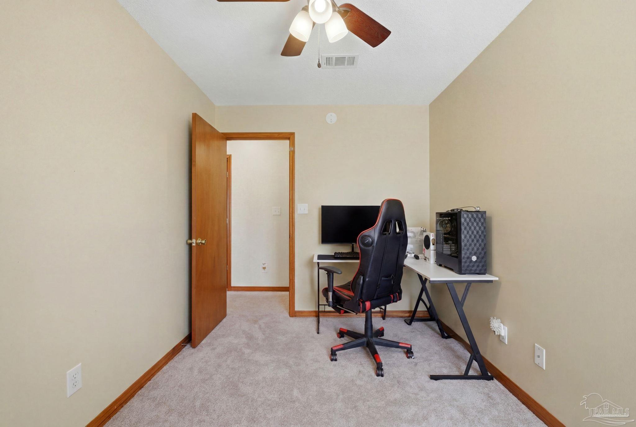 6870 Martin Road Milton, FL 32570 - Photo 25 of 48 a view of a workspace with furniture and a window