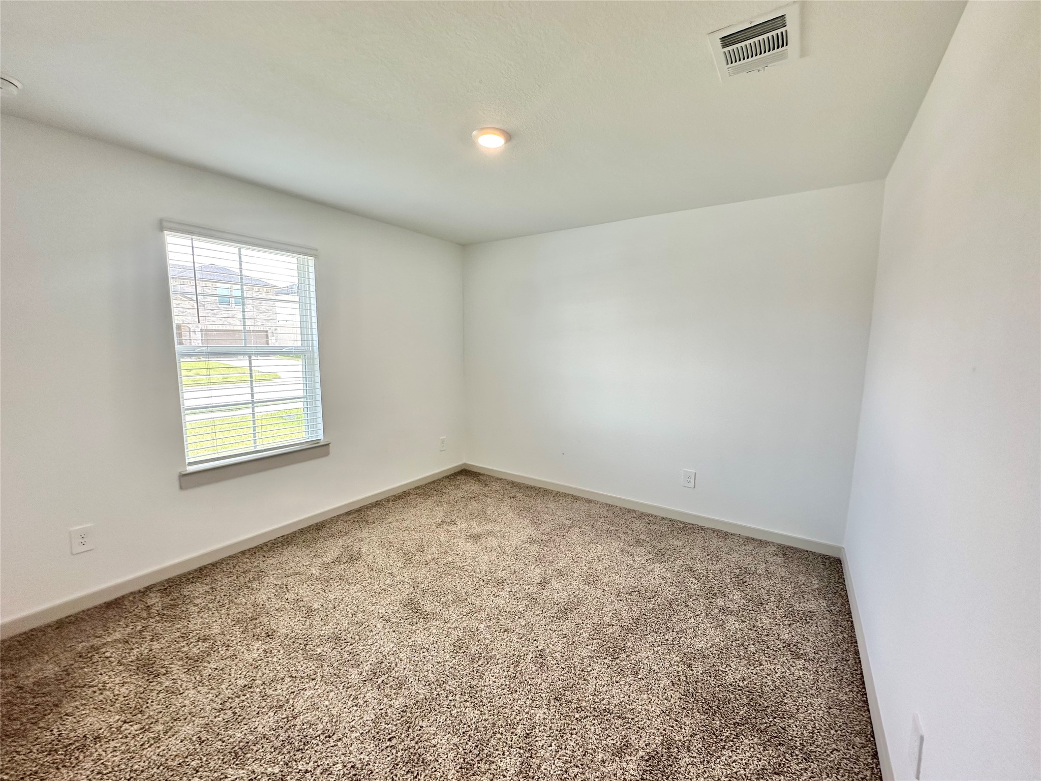 1107 Curly Angora Court Rosharon, TX 77583 - Photo 14 of 42 an empty room with a window