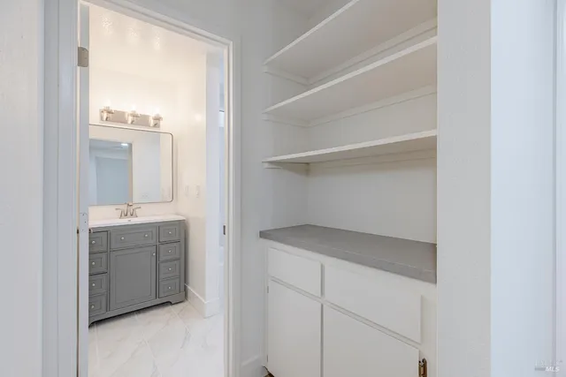 a room with a cabinets and washer