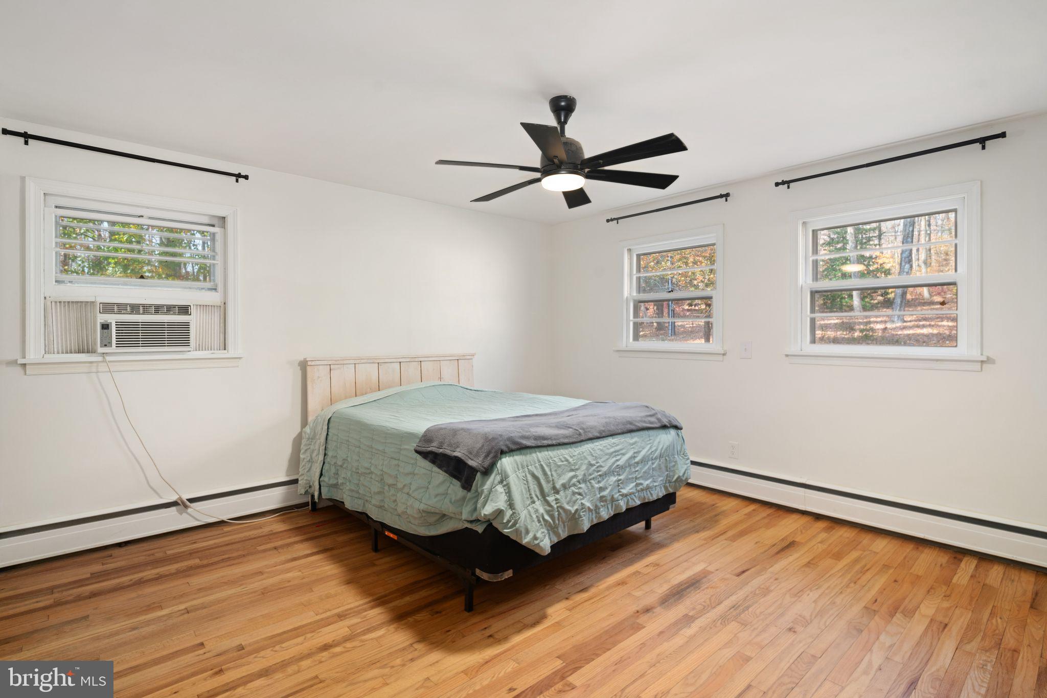 2003 West Rock Road Perkasie, PA 18944 - Photo 14 of 32 a bedroom with a bed and wooden floor