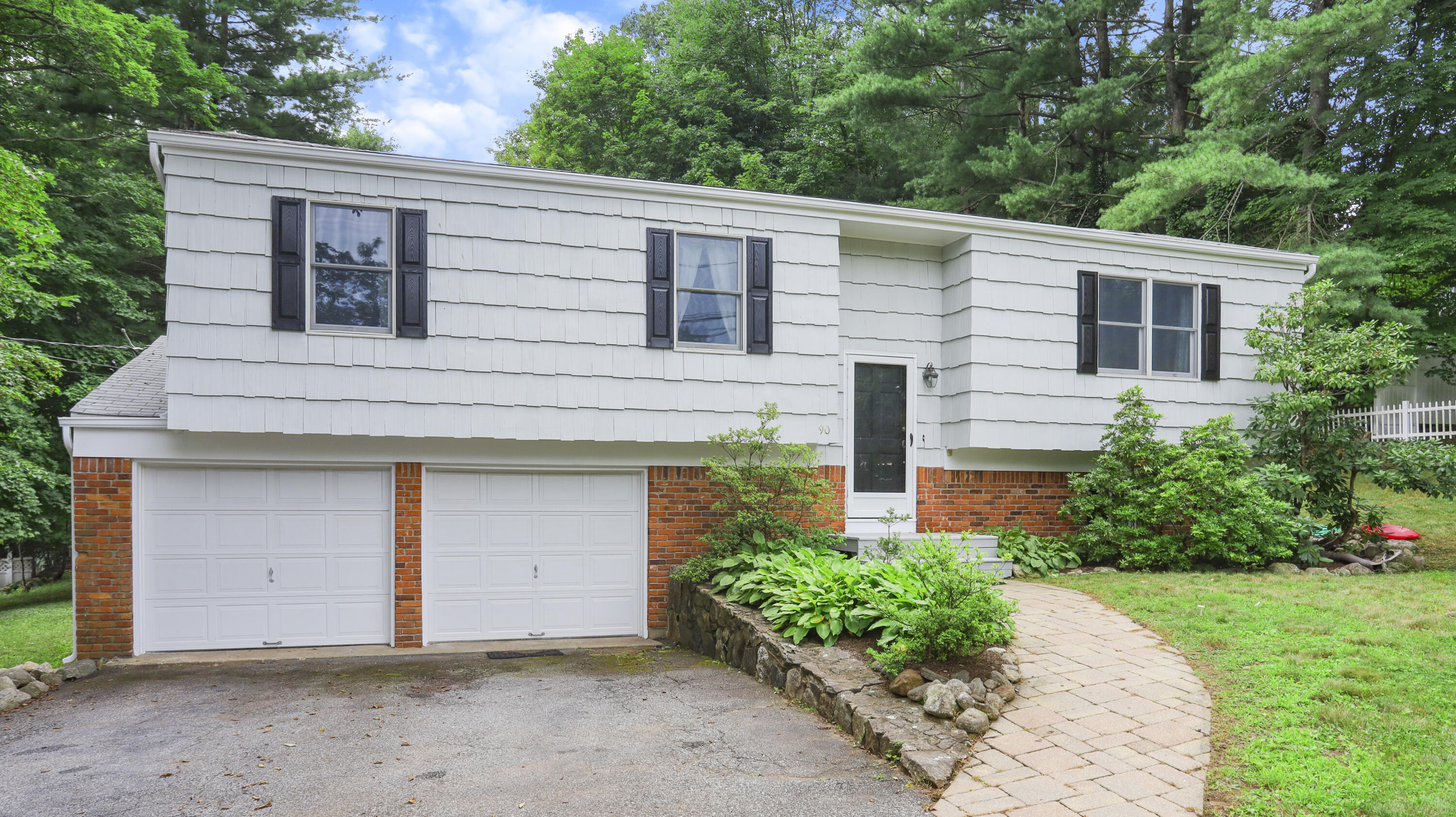 90 Cedar Heights Road Stamford, CT 06905 - Photo 1 of 30 a house with a outdoor space