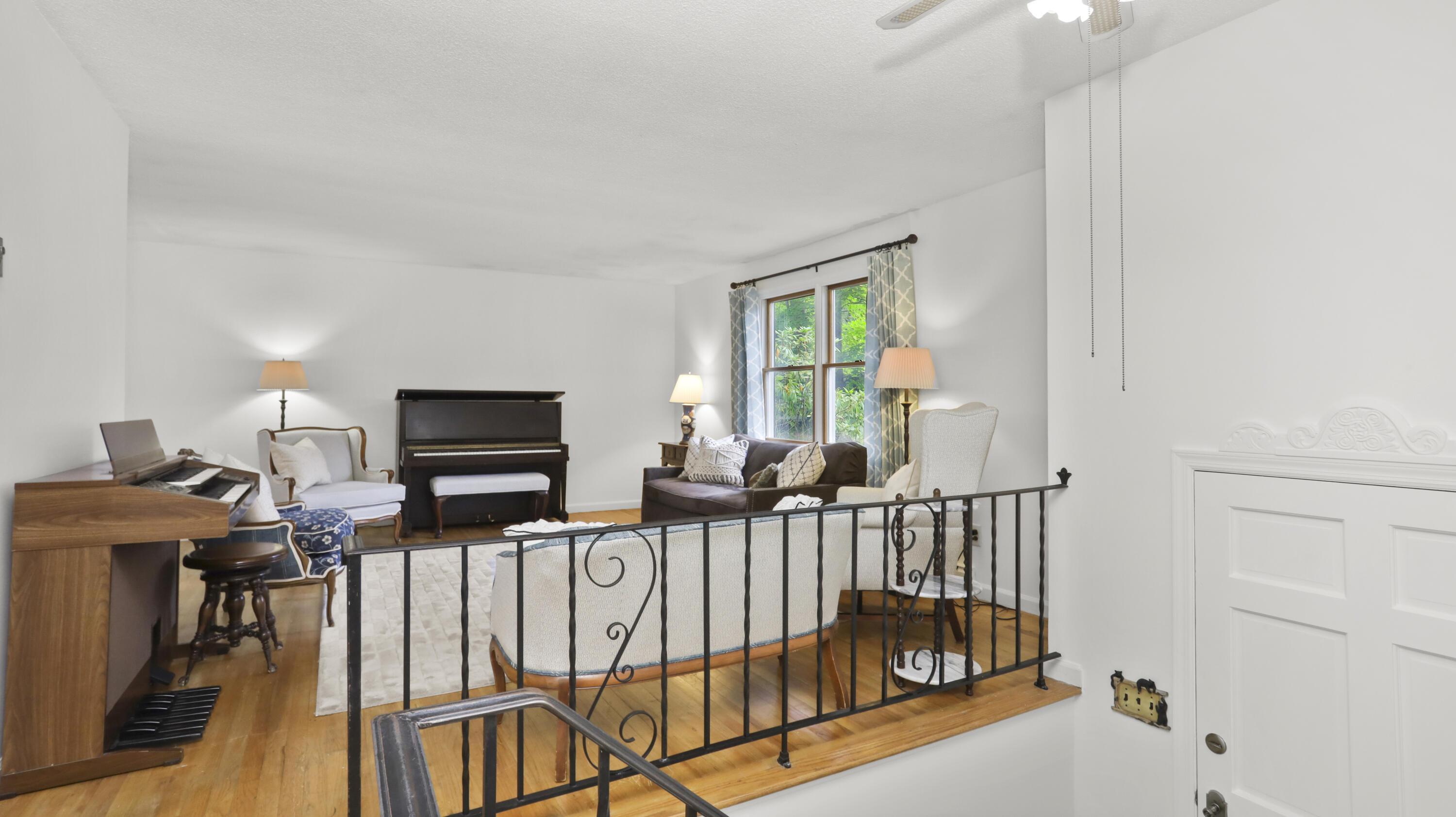 90 Cedar Heights Road Stamford, CT 06905 - Photo 3 of 30 a room with furniture a flat screen tv and a window