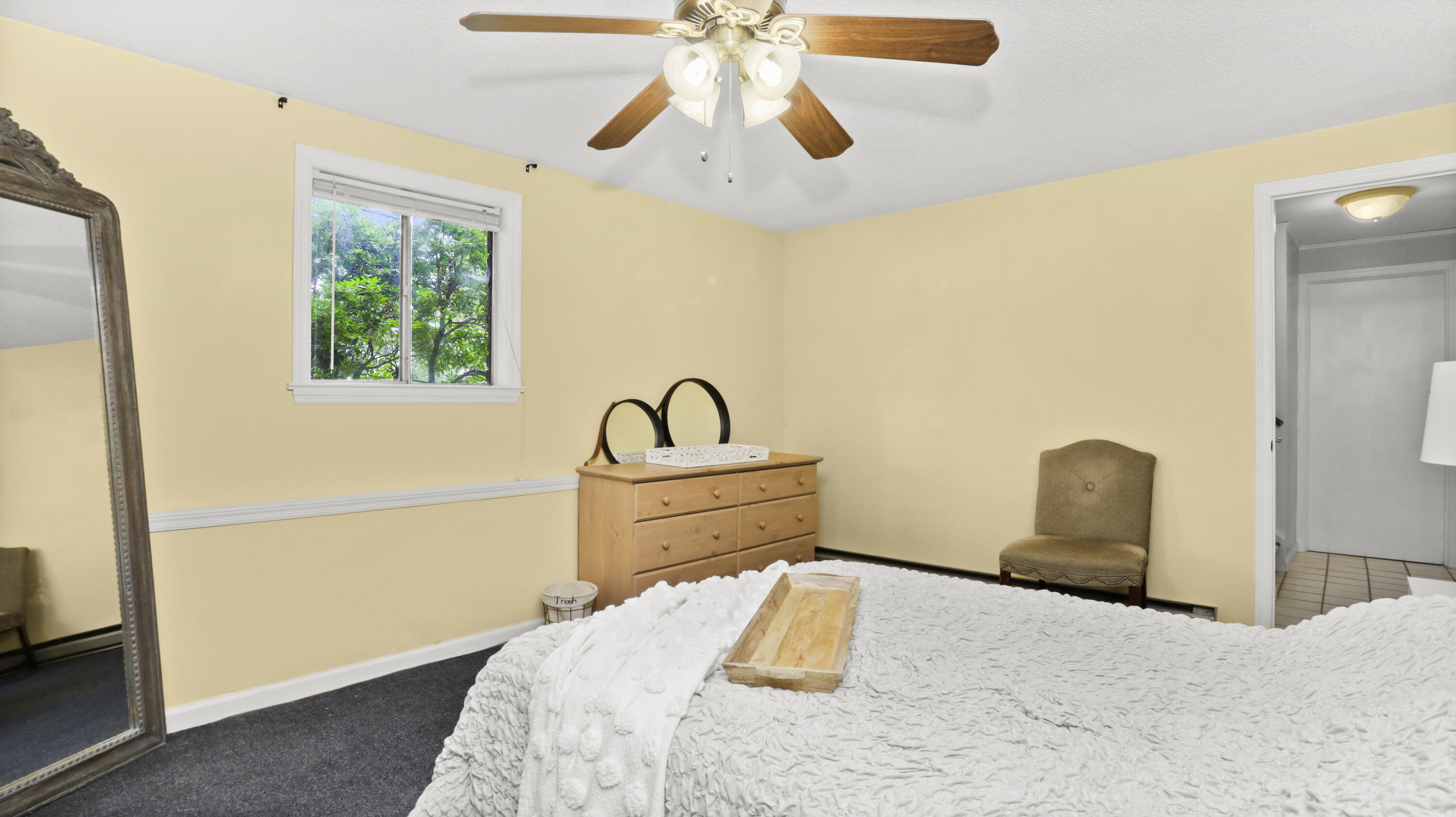90 Cedar Heights Road Stamford, CT 06905 - Photo 22 of 30 a bedroom with a bed and a chandelier