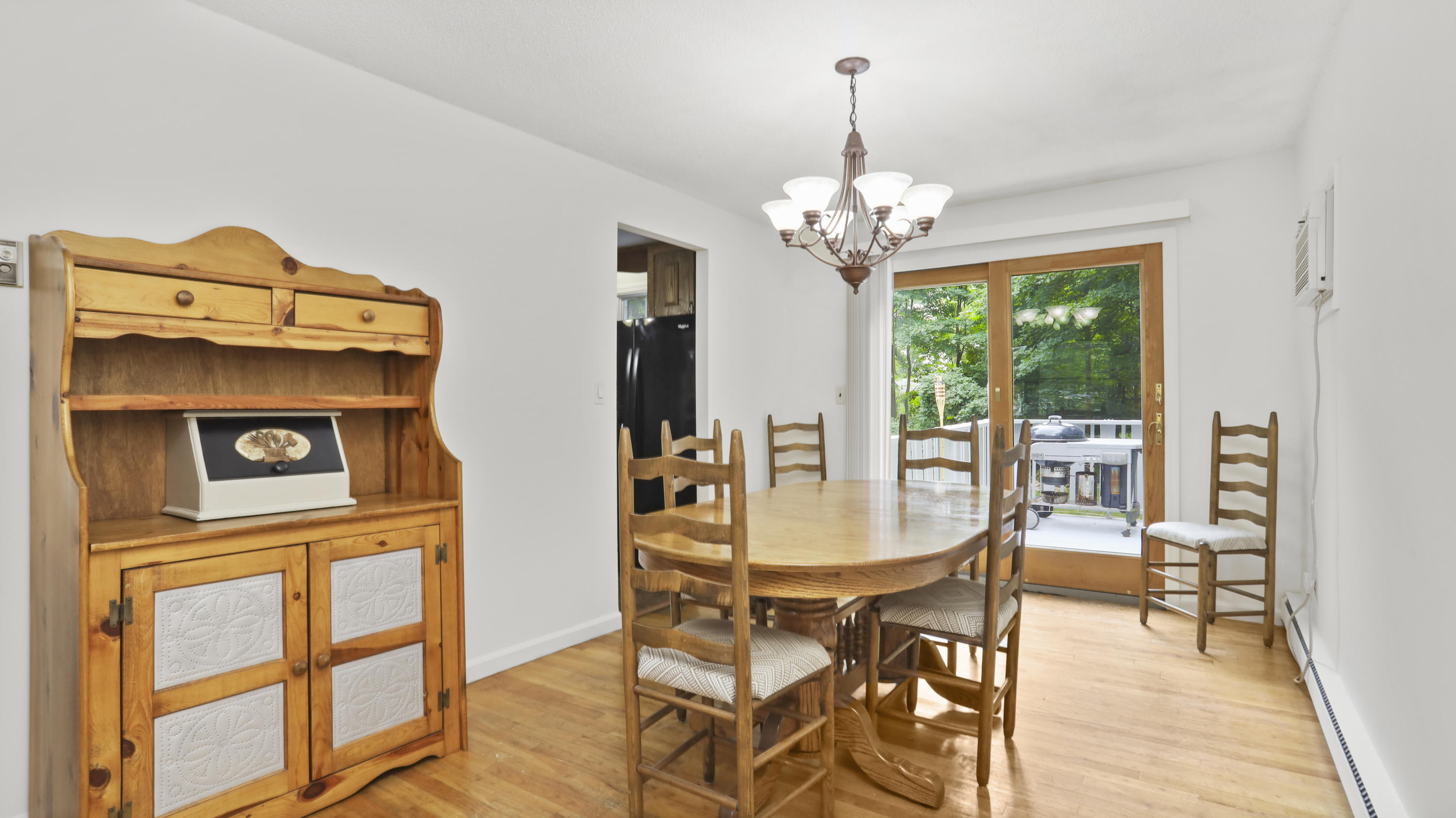 90 Cedar Heights Road Stamford, CT 06905 - Photo 8 of 30 a dining room with furniture a chandelier and wooden floor
