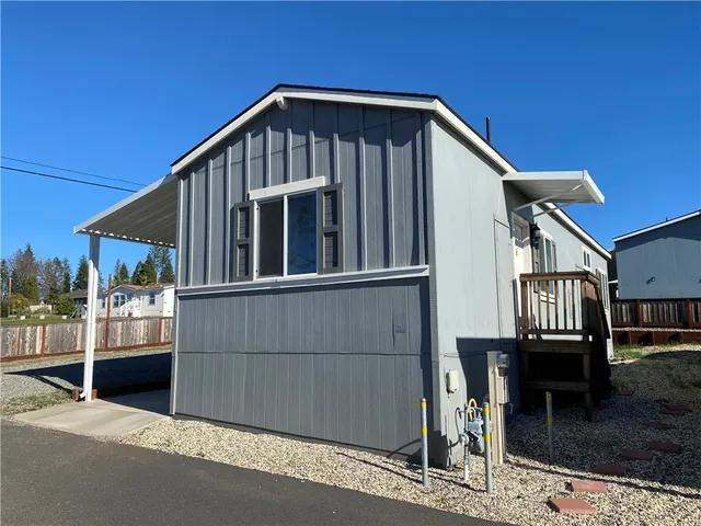 a front view of a house with wooden fence