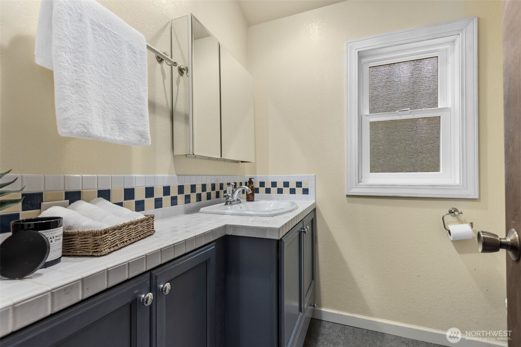 100 East Twanoh Heights Road South Belfair, WA 98528 - Photo 20 of 40 a bathroom with a sink and a mirror