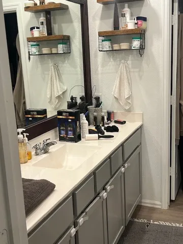 a bed sitting in a bedroom next to a window