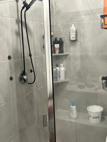 a bedroom with a bed and cabinets