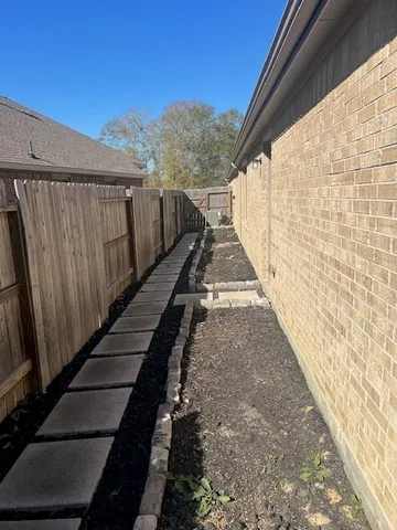 a view of balcony with wooden floor and fence