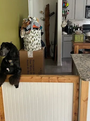 a bedroom with a bed and a chair