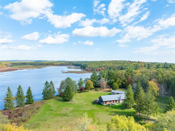 a view of a lake with a big yard