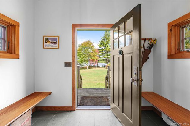 a view of a living room with furniture and a flat screen tv