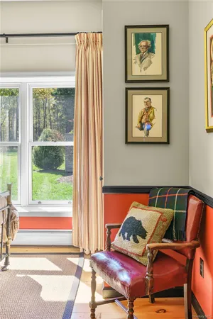 a living room with furniture cabinets and a book shelf