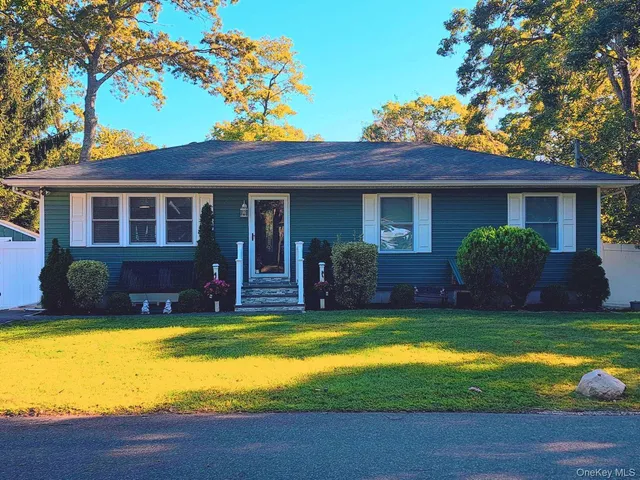 a view of a house with pool and a yard