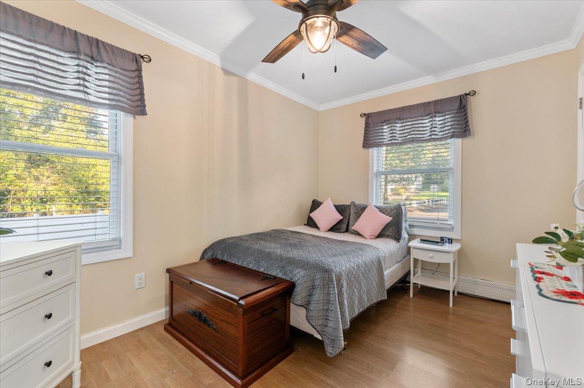 212 Locust Drive Rocky Point, NY 11778 - Photo 15 of 38 a bedroom with a bed and a window