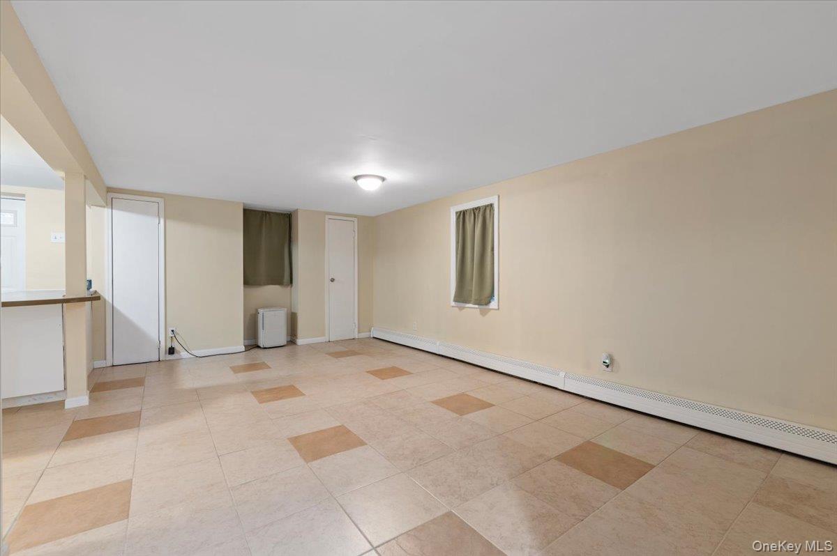 212 Locust Drive Rocky Point, NY 11778 - Photo 23 of 38 a view of an empty room with a window