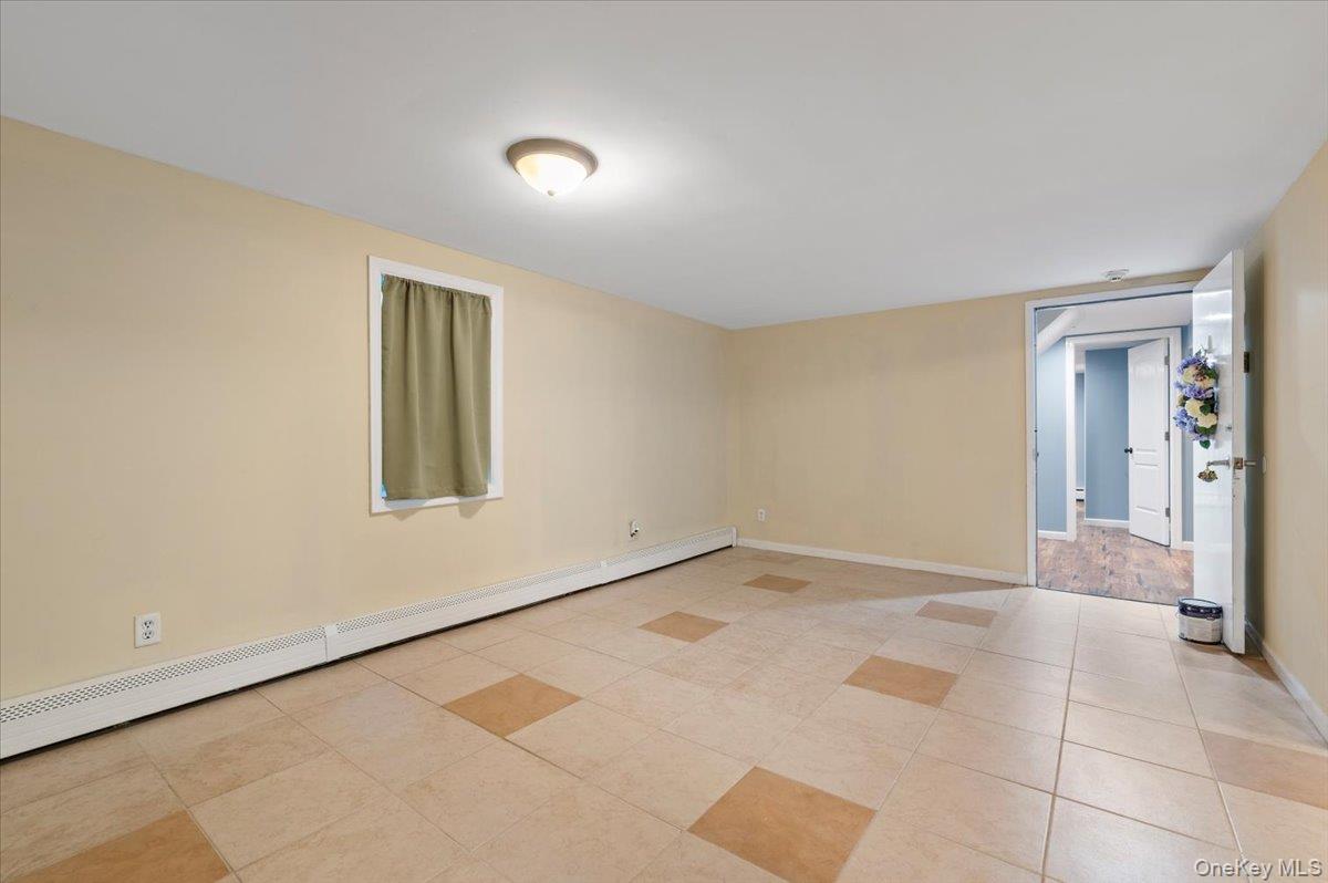 212 Locust Drive Rocky Point, NY 11778 - Photo 25 of 38 a view of an empty room with a window