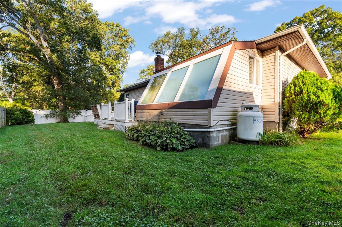 212 Locust Drive Rocky Point, NY 11778 - Photo 31 of 38 a view of a house with a yard