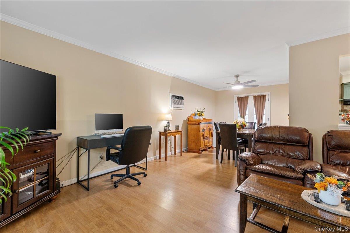 212 Locust Drive Rocky Point, NY 11778 - Photo 7 of 38 a living room with furniture and a flat screen tv