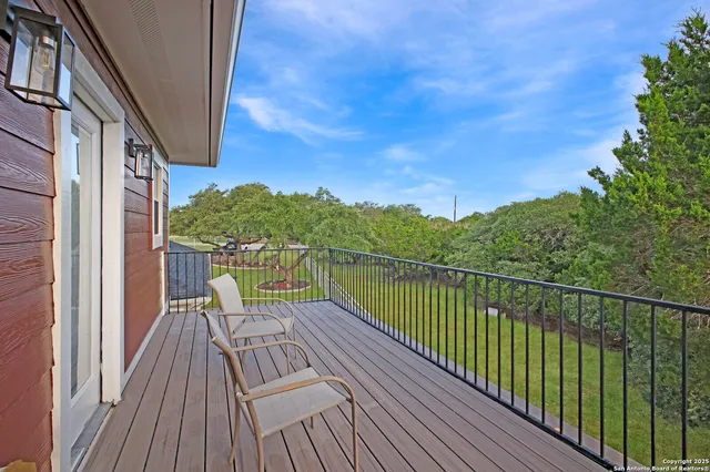a view of a swimming pool with a patio