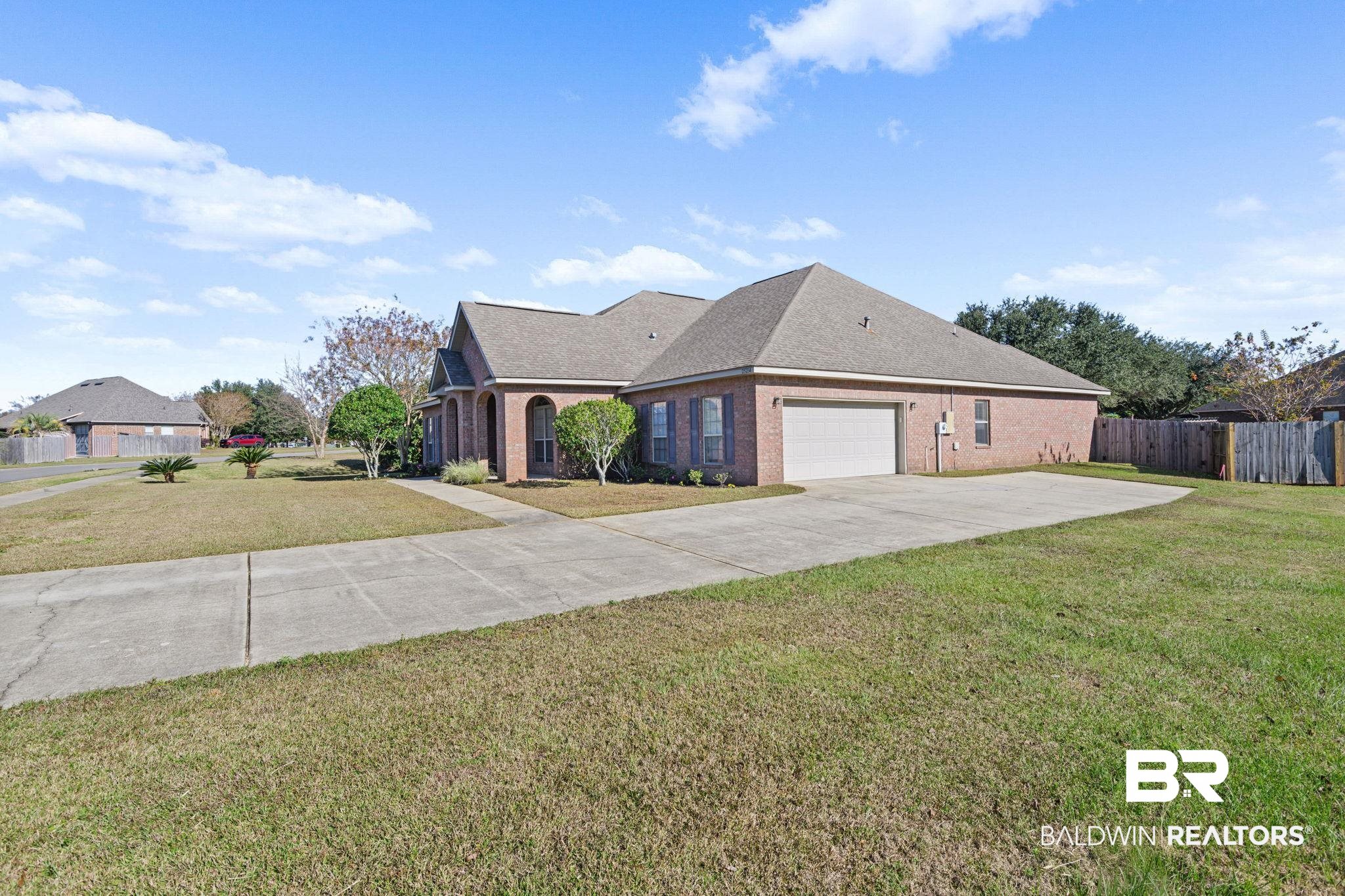 25234 Fairfax Road Daphne, AL 36526 - Photo 4 of 45 View of front of house featuring brick siding, concrete driveway, and a shingled roof