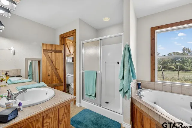 a bedroom with a bed and a closet