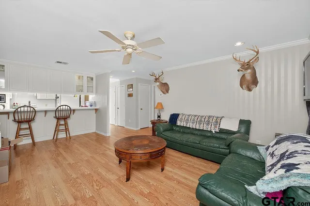 a kitchen with stainless steel appliances a sink and cabinets