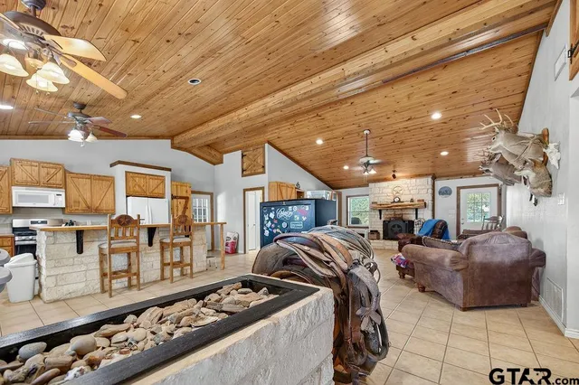 a bedroom with furniture and a fireplace