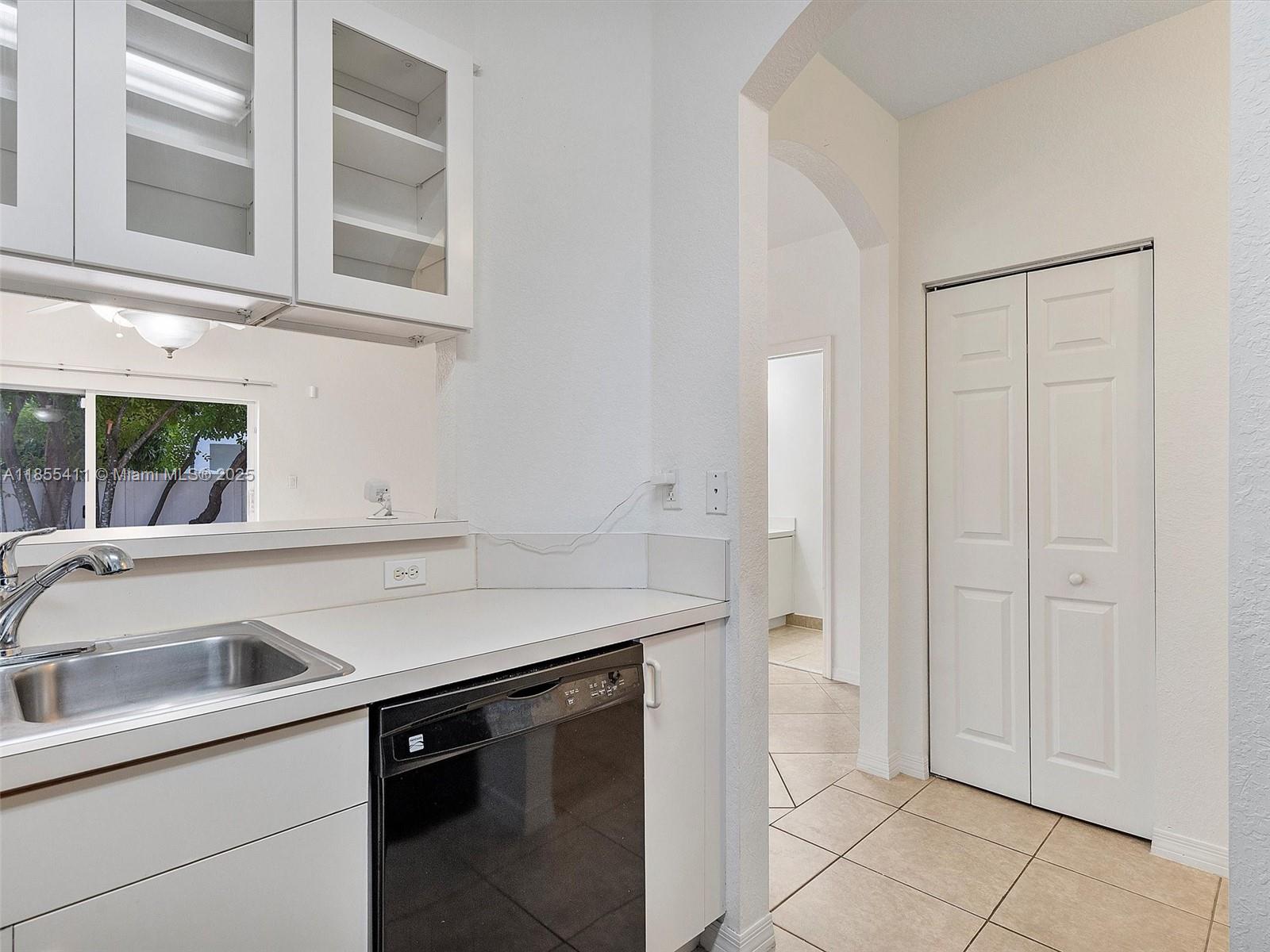 4964 Southwest 128th Avenue Miramar, FL 33027 - Photo 14 of 38 a view white cabinets and a sink