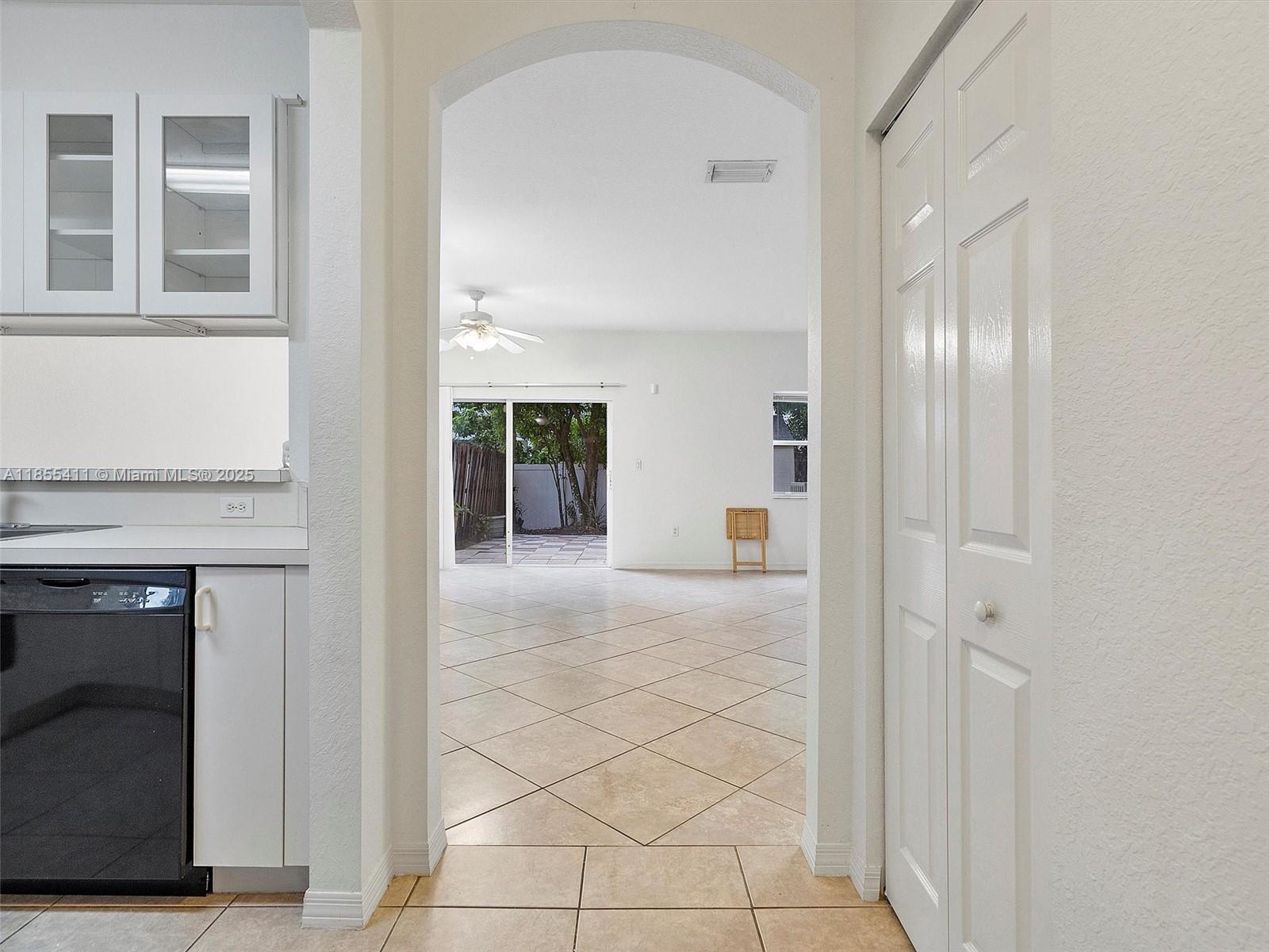 4964 Southwest 128th Avenue Miramar, FL 33027 - Photo 15 of 38 a view of a hallway with wooden cabinets