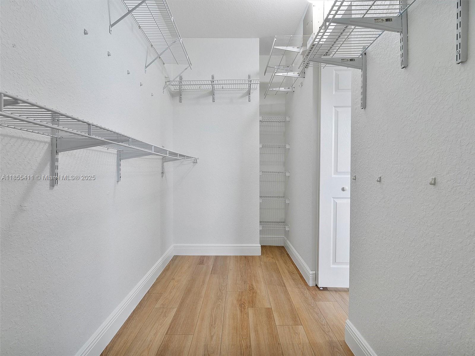 4964 Southwest 128th Avenue Miramar, FL 33027 - Photo 21 of 38 a view of a room with racks on the wall