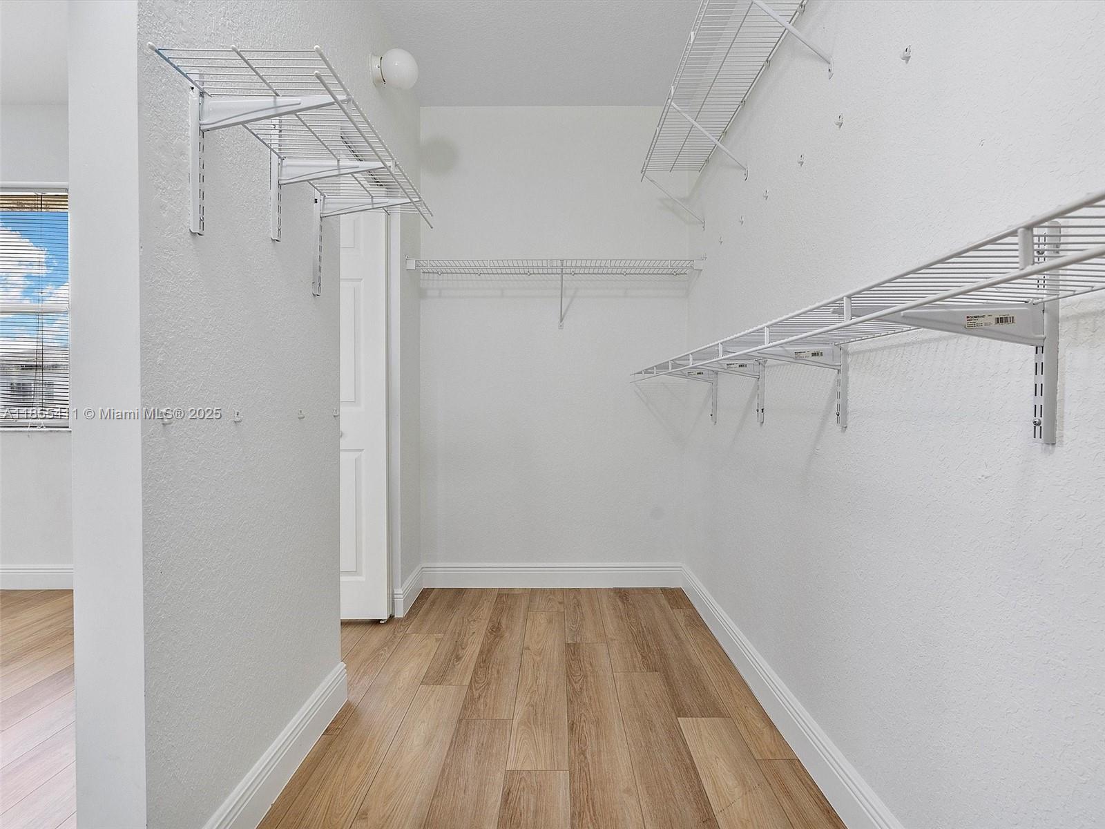 4964 Southwest 128th Avenue Miramar, FL 33027 - Photo 22 of 38 a view of a room with wooden floor