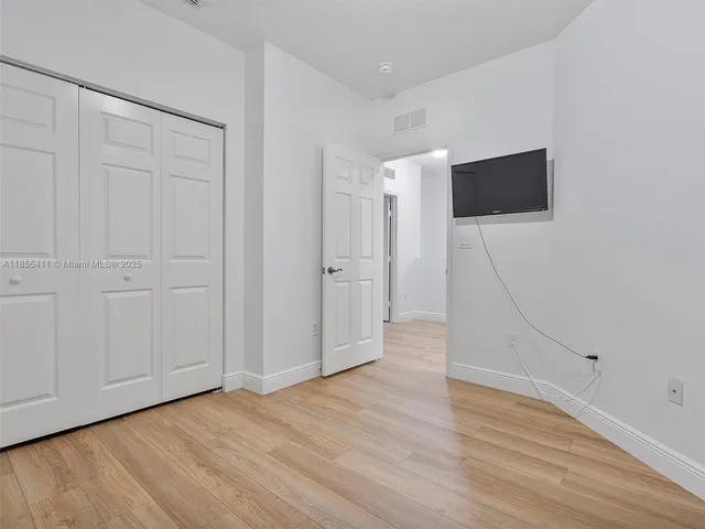 a view of a livingroom with wooden floor