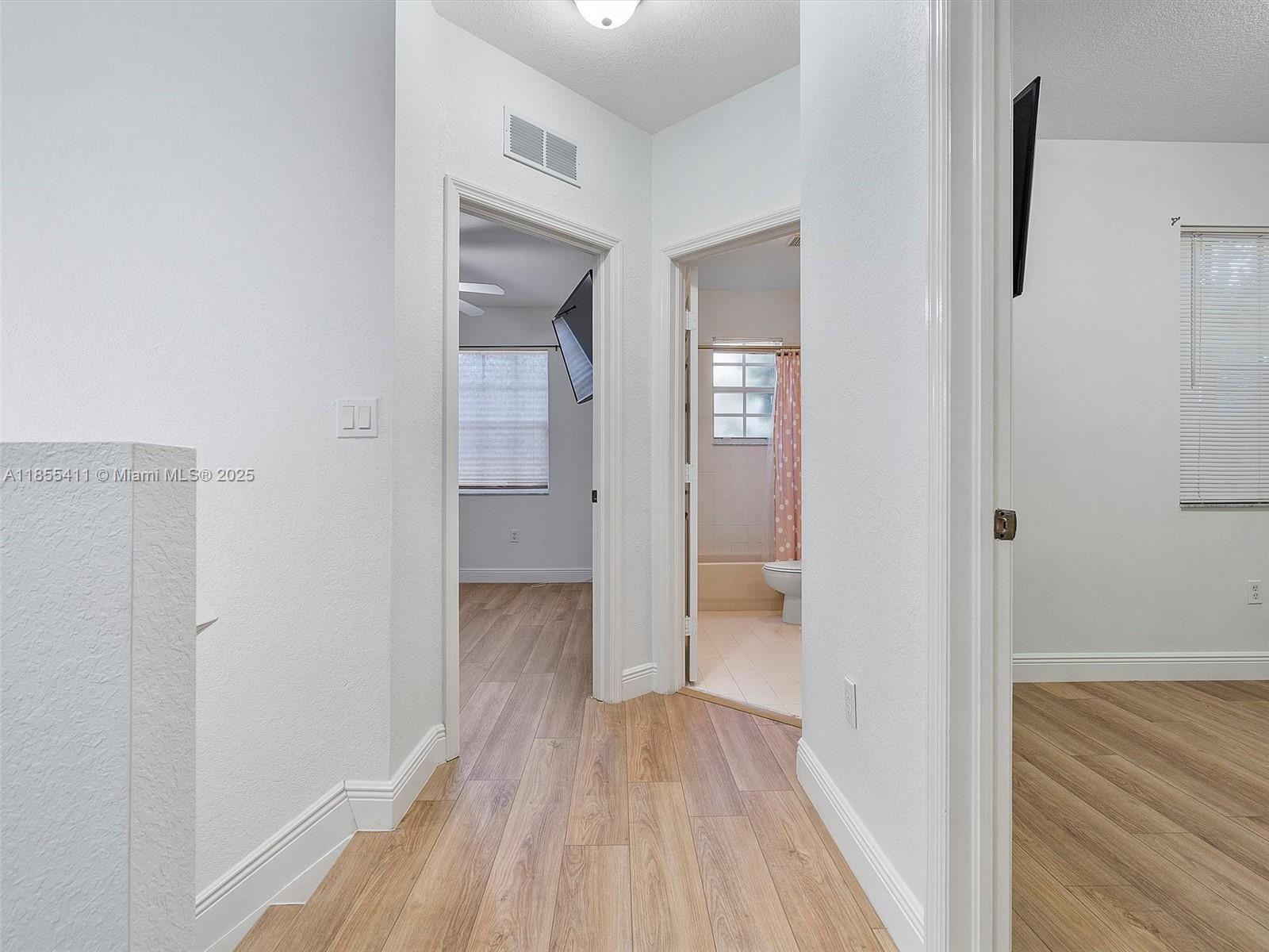 4964 Southwest 128th Avenue Miramar, FL 33027 - Photo 30 of 38 a view of a room with wooden floor