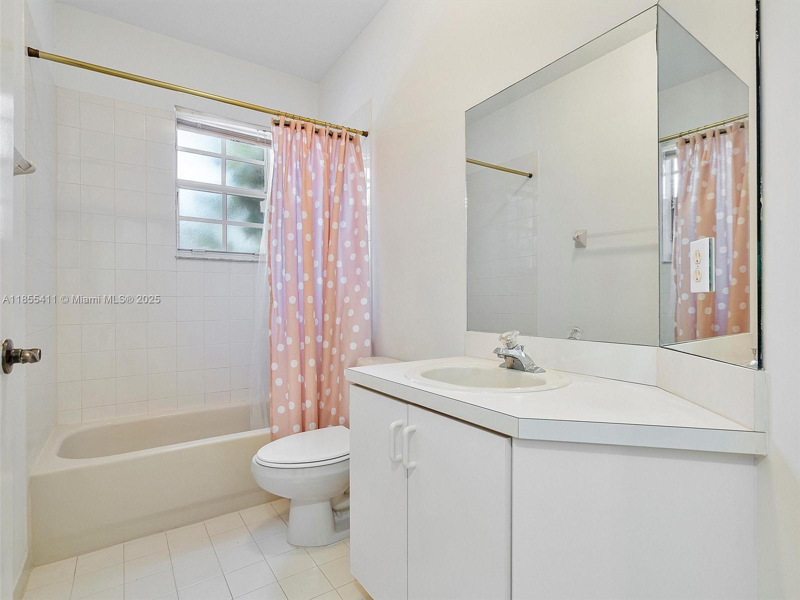 4964 Southwest 128th Avenue Miramar, FL 33027 - Photo 32 of 38 a bathroom with a sink toilet and shower