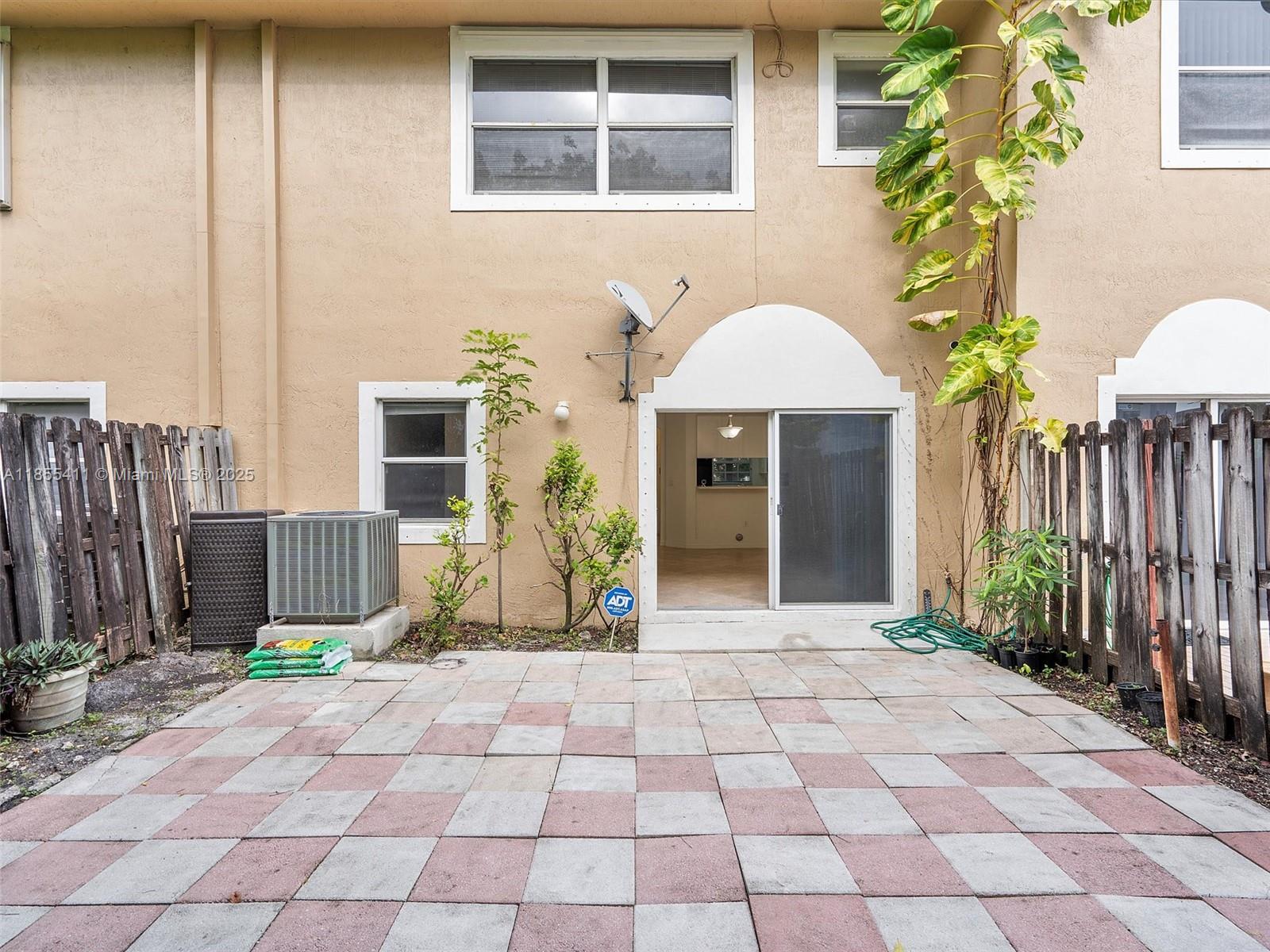4964 Southwest 128th Avenue Miramar, FL 33027 - Photo 38 of 38 a view of a entryway with flower plants
