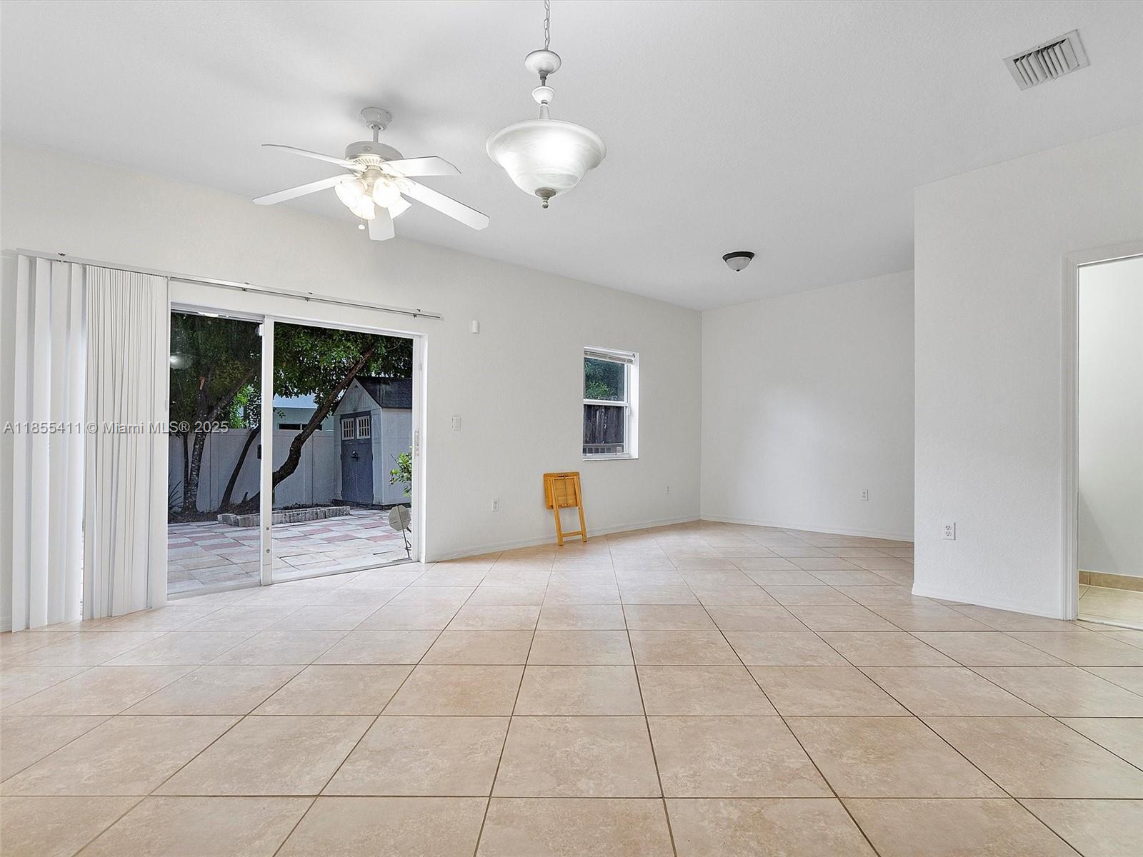 4964 Southwest 128th Avenue Miramar, FL 33027 - Photo 4 of 38 a view of livingroom with workspace