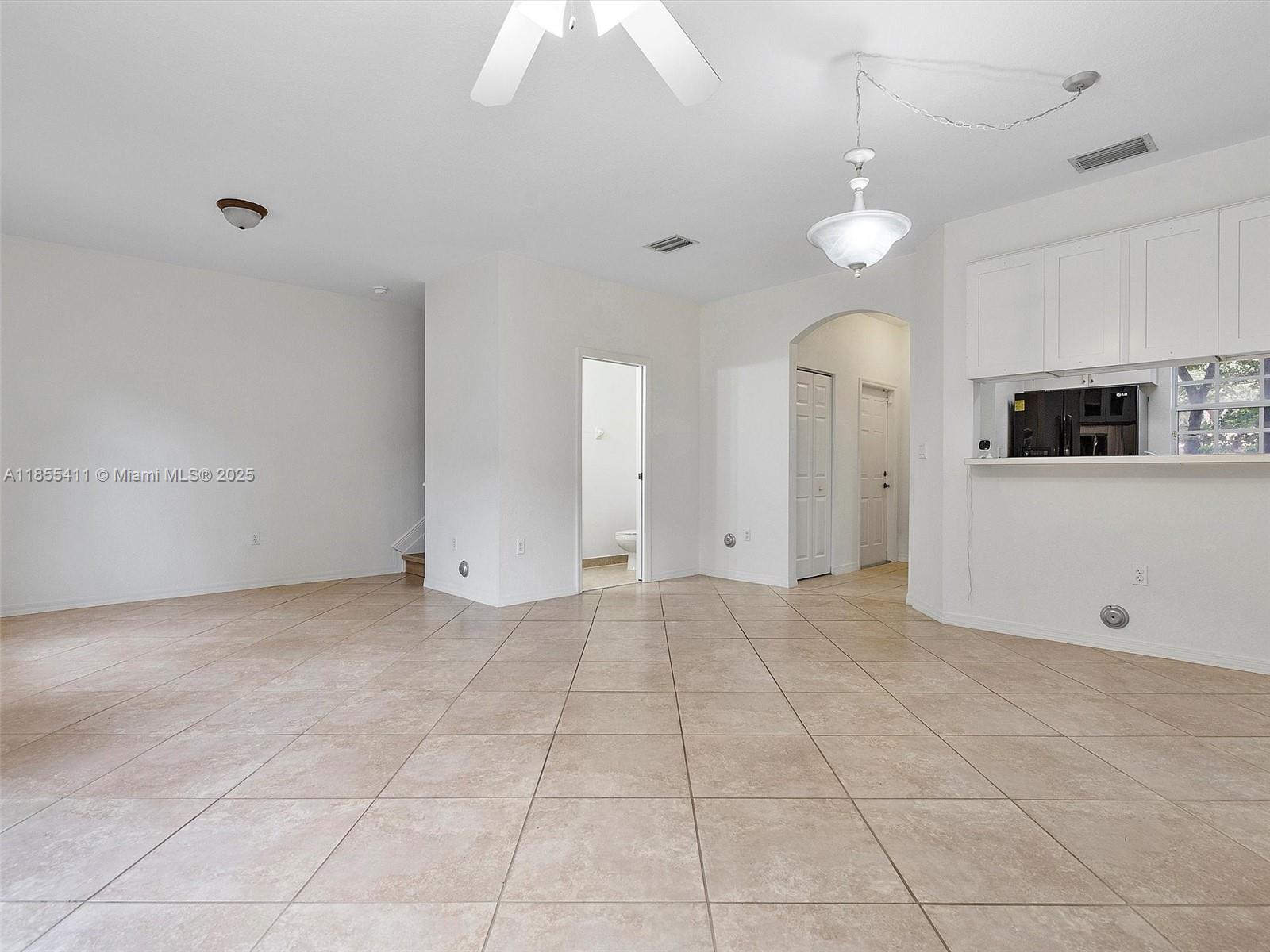 4964 Southwest 128th Avenue Miramar, FL 33027 - Photo 5 of 38 a view of a livingroom with an empty space