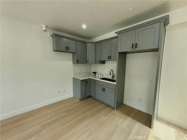 a kitchen with stainless steel appliances a refrigerator sink and cabinets