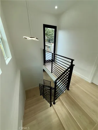 a view of a hallway with stairs