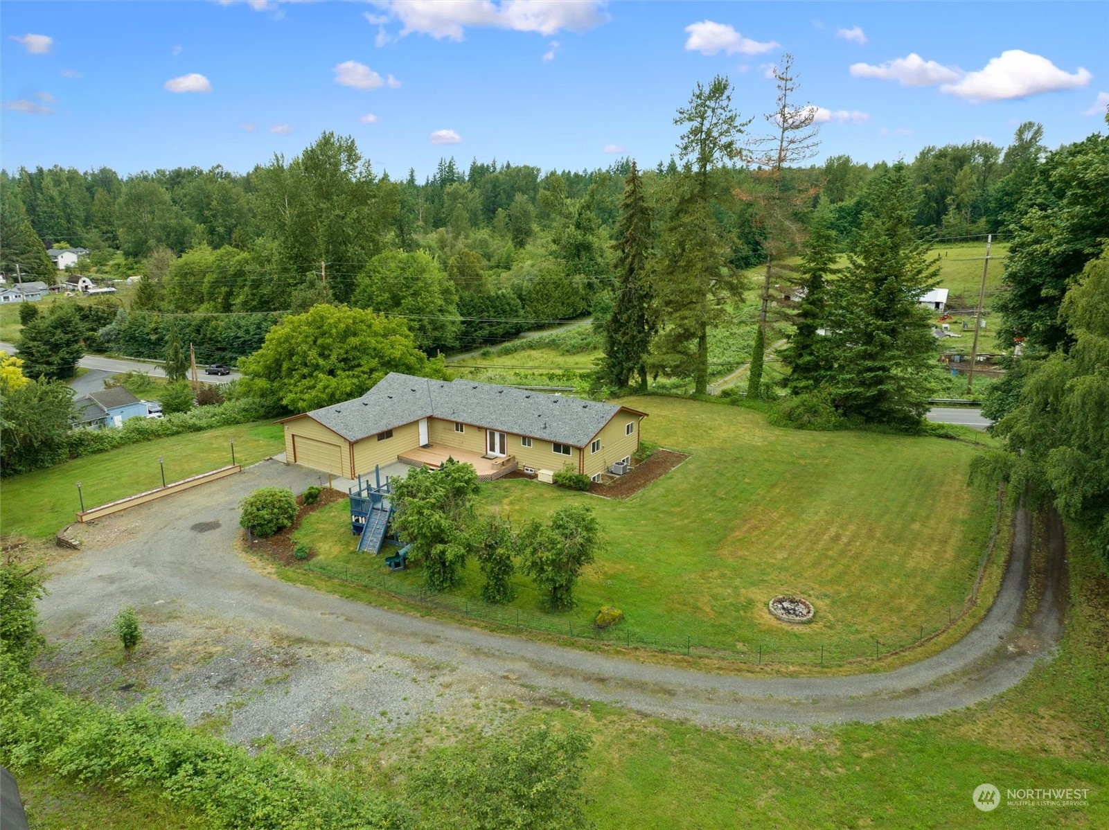 14220 Three Lakes Road Snohomish, WA 98290 - Photo 1 of 31 a view of a swimming pool with a yard
