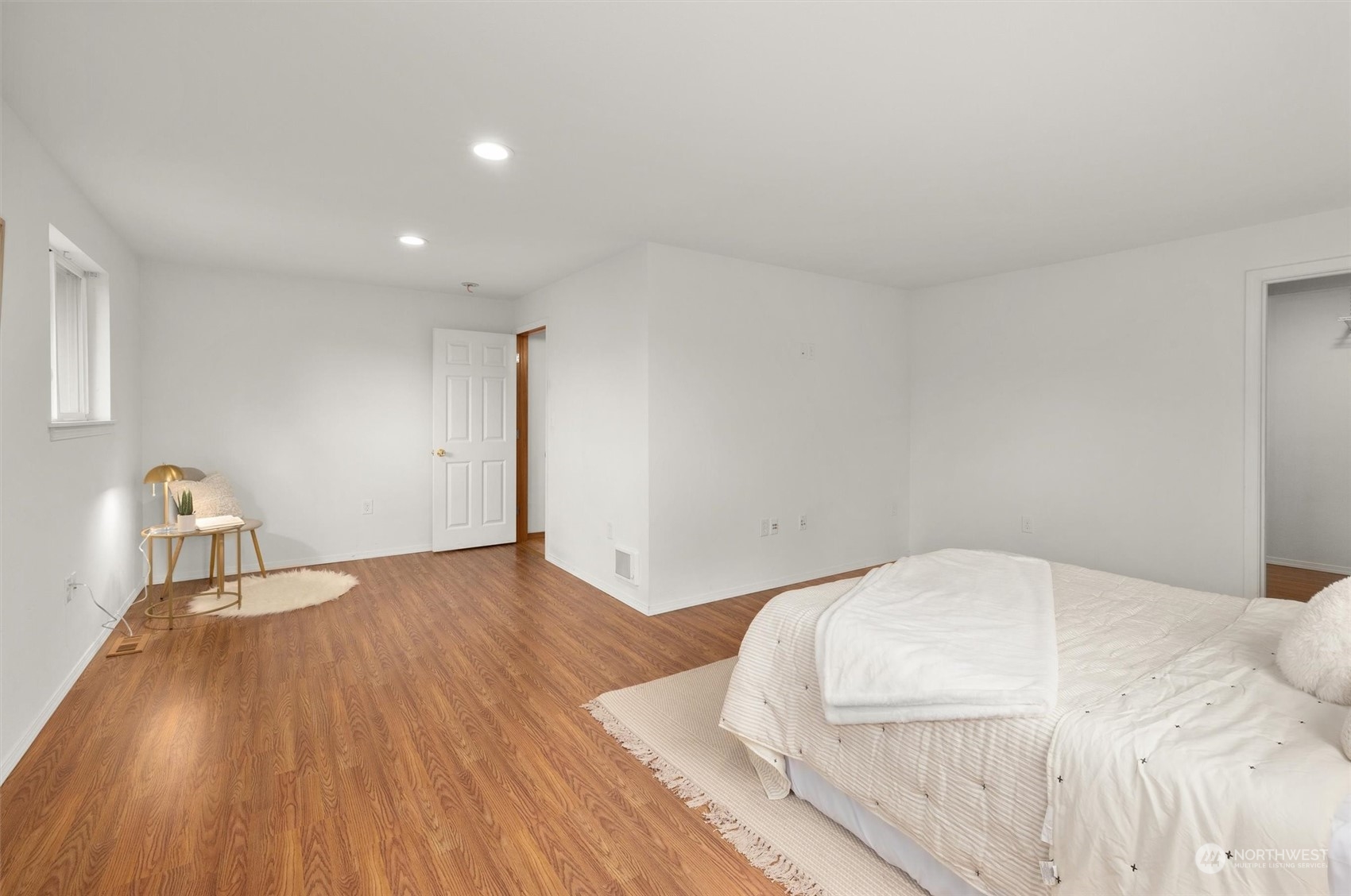 14220 Three Lakes Road Snohomish, WA 98290 - Photo 11 of 31 a bedroom with a bed and wooden floor