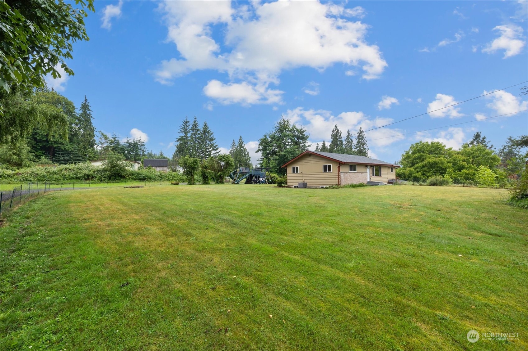 14220 Three Lakes Road Snohomish, WA 98290 - Photo 27 of 31 a white house with a big yard and large trees