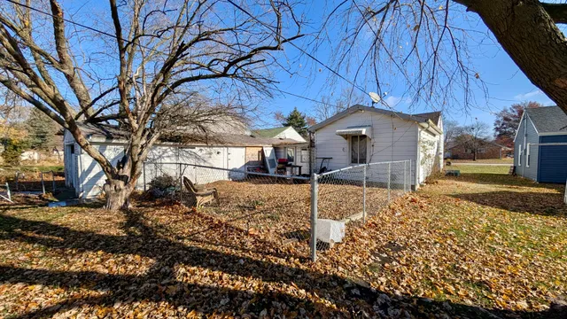 a house with trees in the background