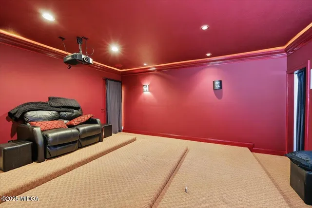 a kitchen with white cabinets and window