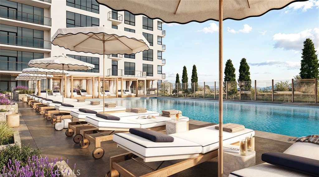 9 Mac Arthur Place, Unit 804 Santa Ana, CA 92707 - Photo 5 of 11 a white building with a table and chairs