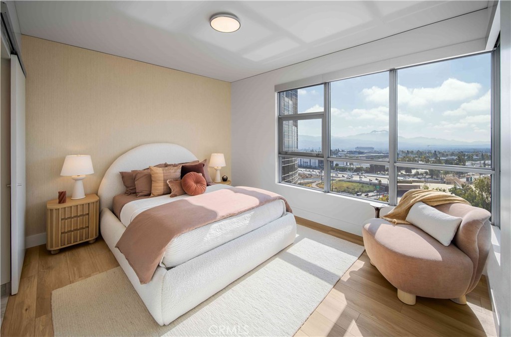 9 Mac Arthur Place, Unit 804 Santa Ana, CA 92707 - Photo 6 of 11 a bedroom with a bed and a large window