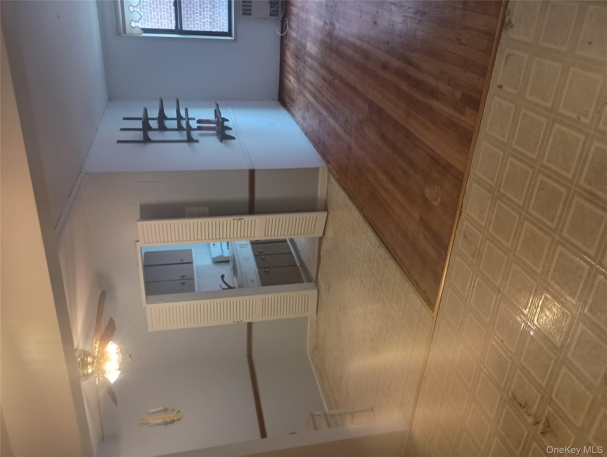 3655 Shore Parkway, Unit 4C Brooklyn, NY 11235 - Photo 2 of 9 a kitchen with granite countertop a refrigerator and a stove