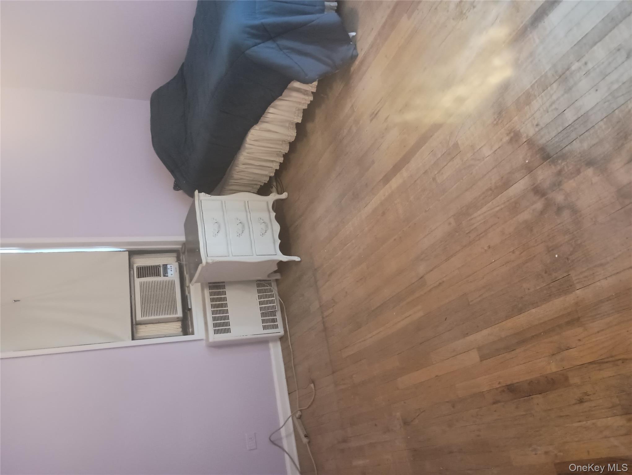 3655 Shore Parkway, Unit 4C Brooklyn, NY 11235 - Photo 5 of 9 a spacious bedroom with a bed and dresser