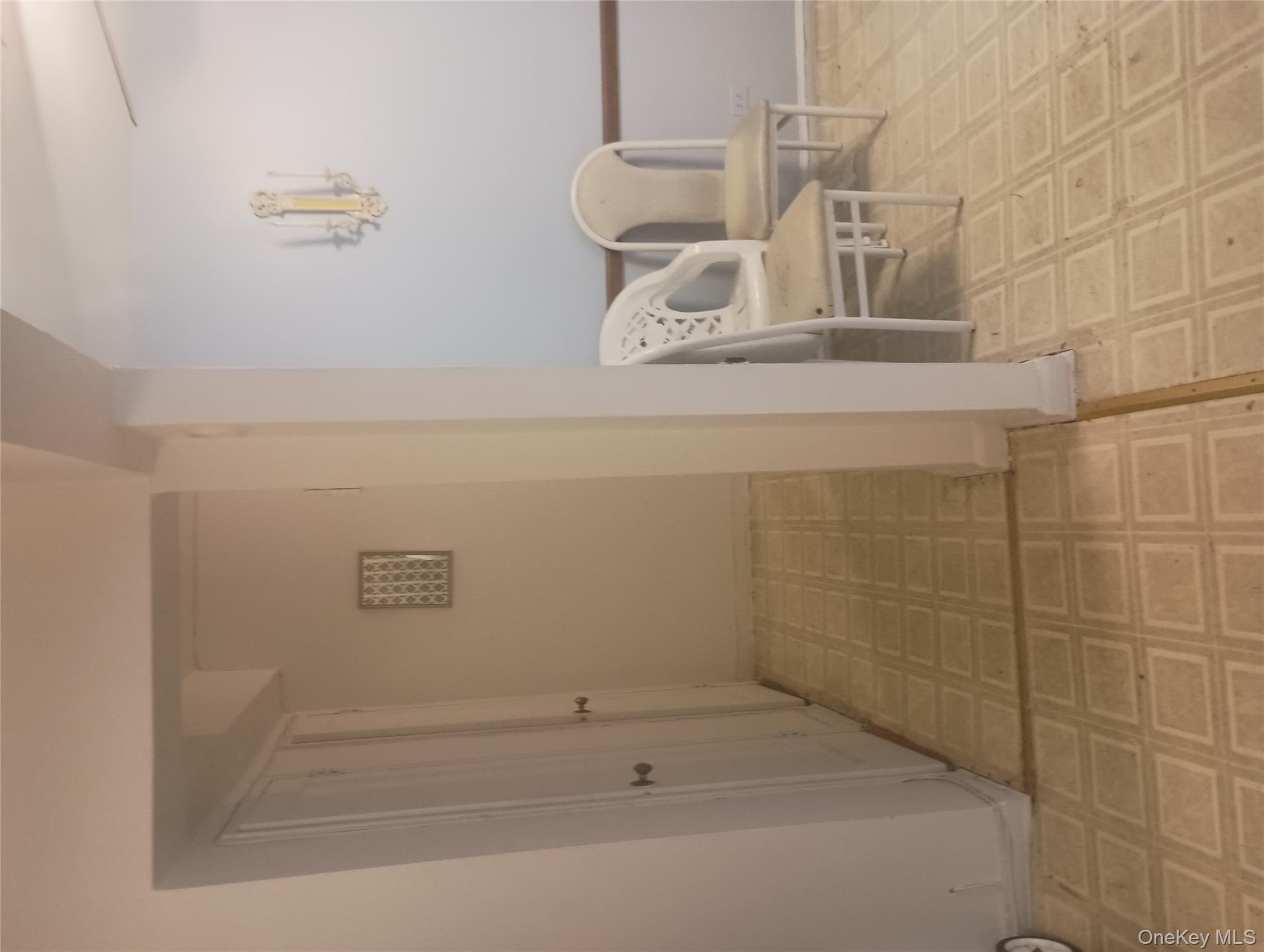 3655 Shore Parkway, Unit 4C Brooklyn, NY 11235 - Photo 8 of 9 a view of a room with lounge chair and windows